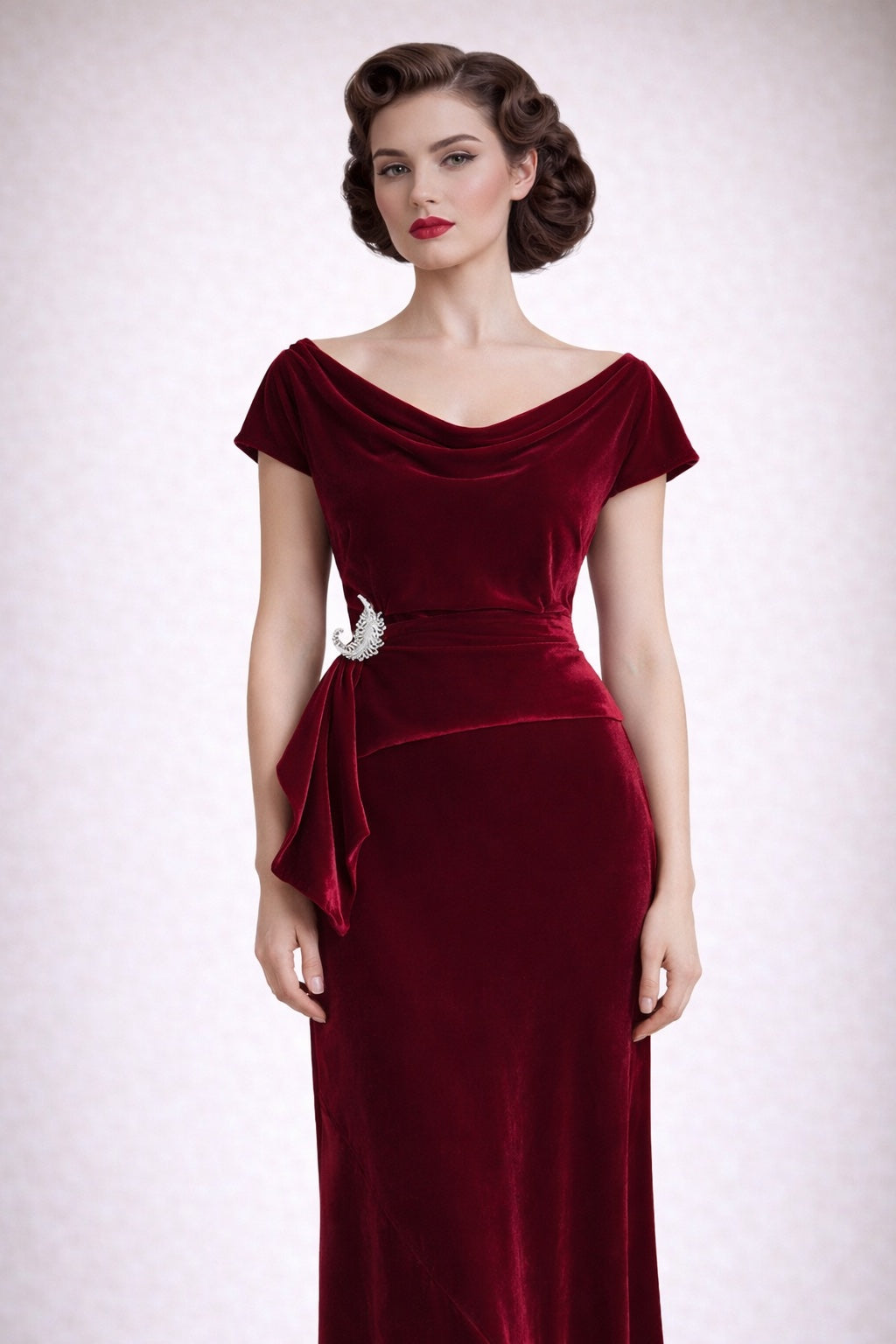 1930s style red velvet maxi dress worn by a model against a white background.