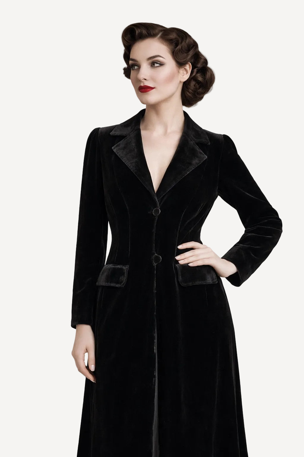 Woman wearing a black velvet coat against a white background