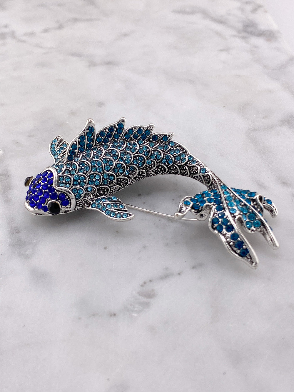 Blue brooch clearance