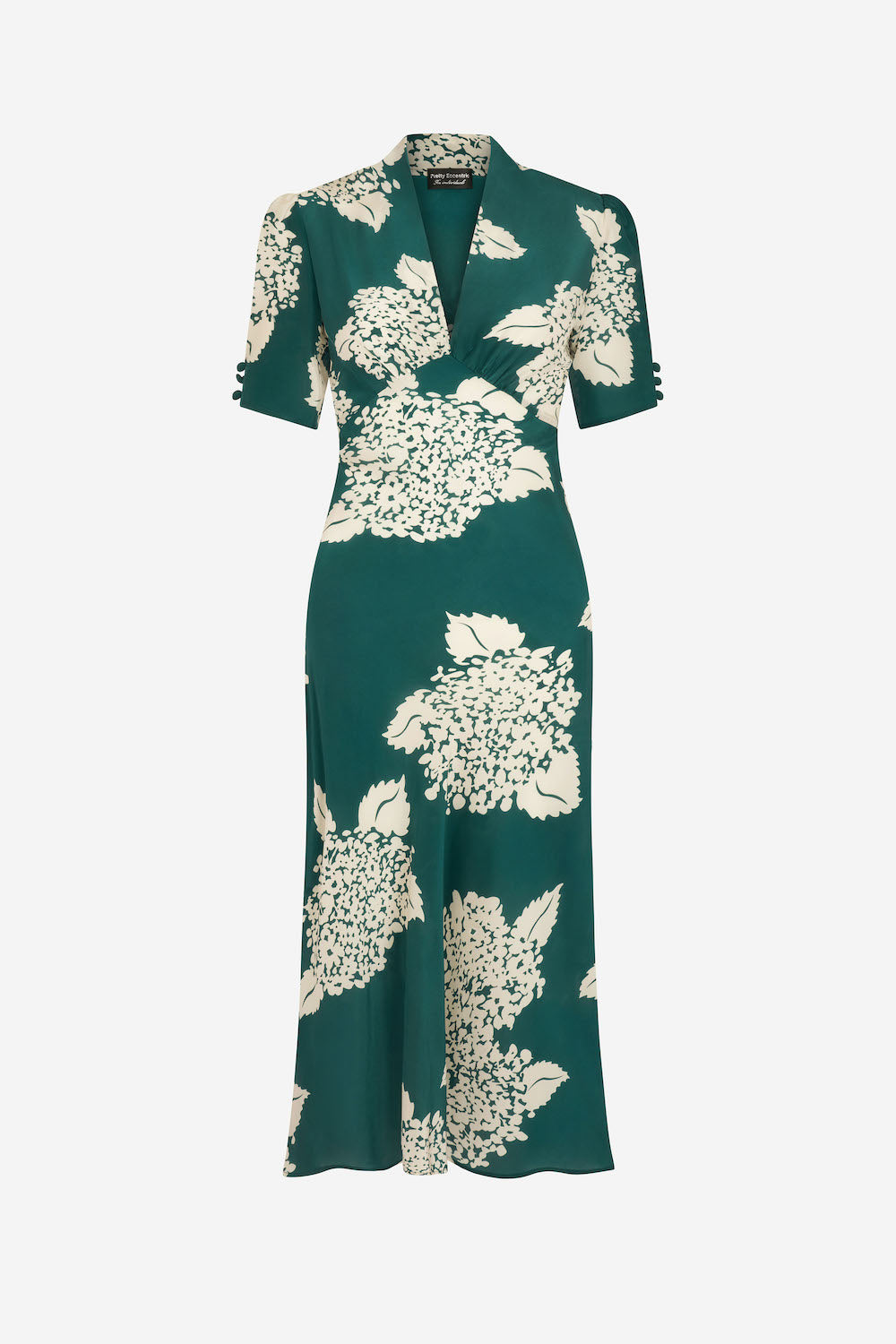 Green dress with white floral pattern on a white background