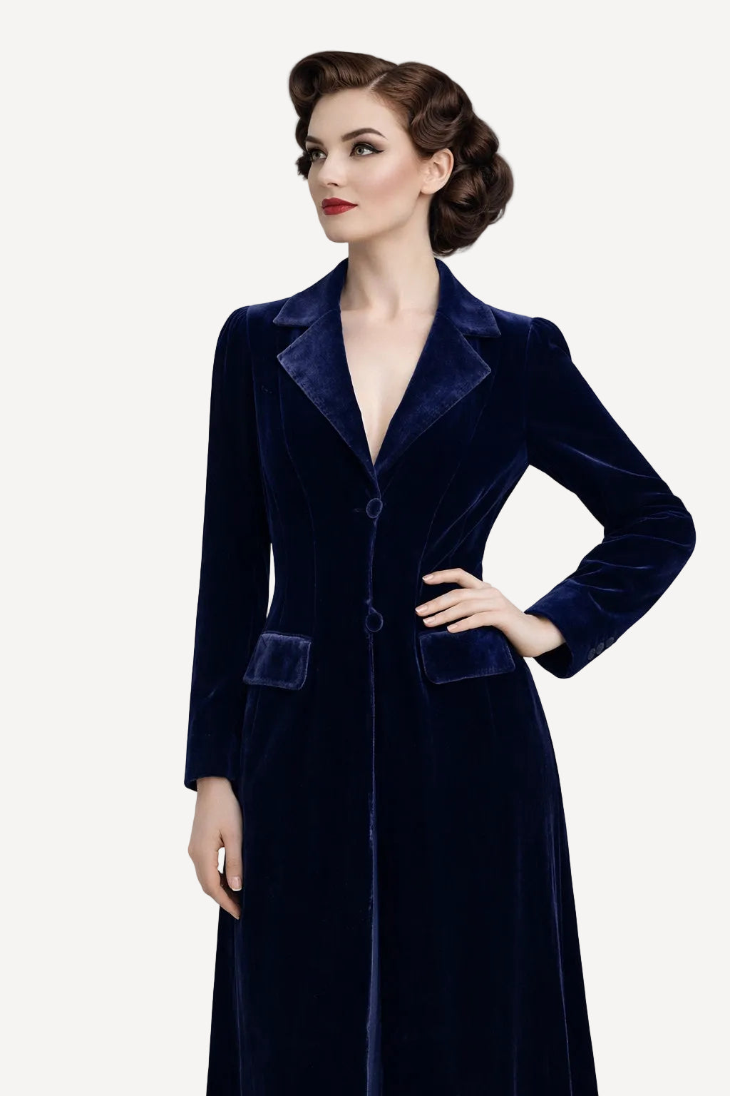 Woman wearing a dark blue velvet coat against a white background