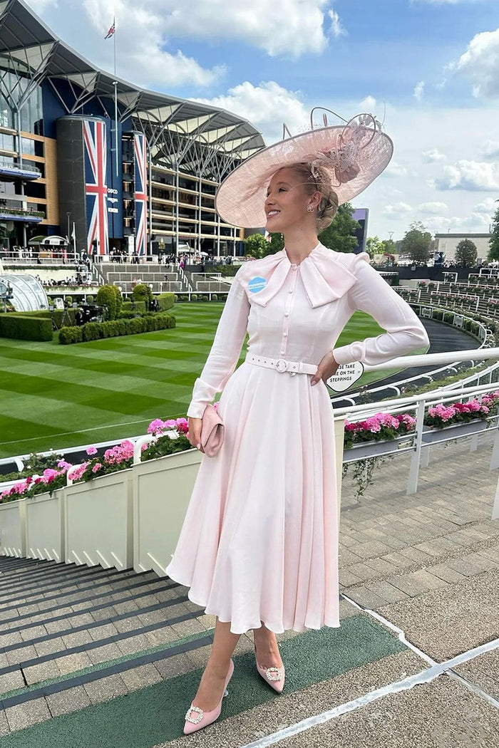 Model wearing floral print aqua jumpsuit