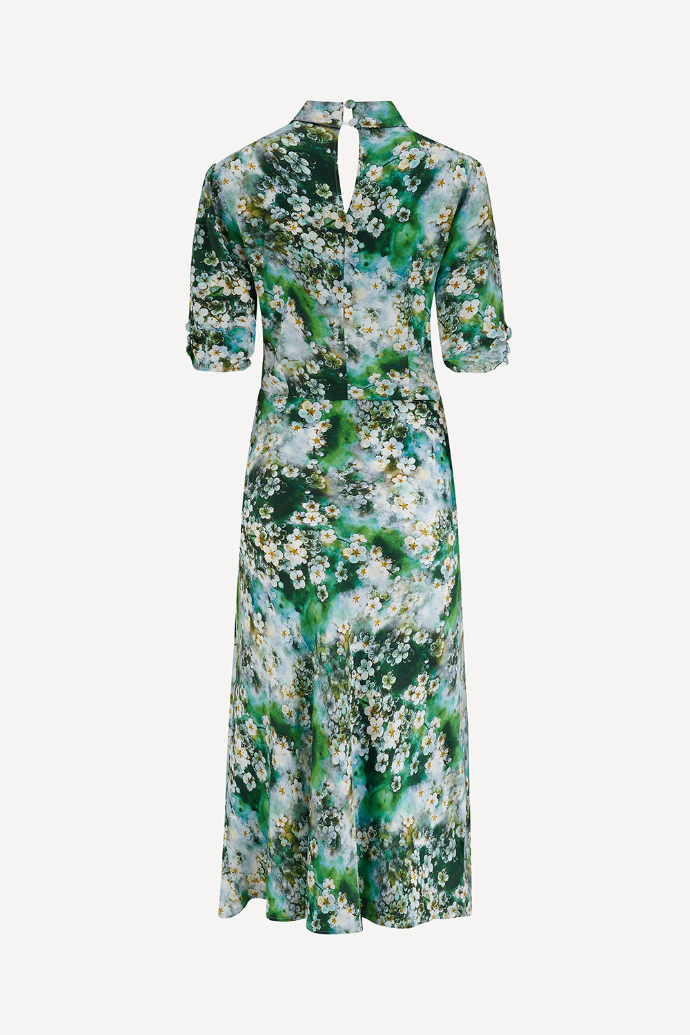 Floral dress with green and white pattern on a white background