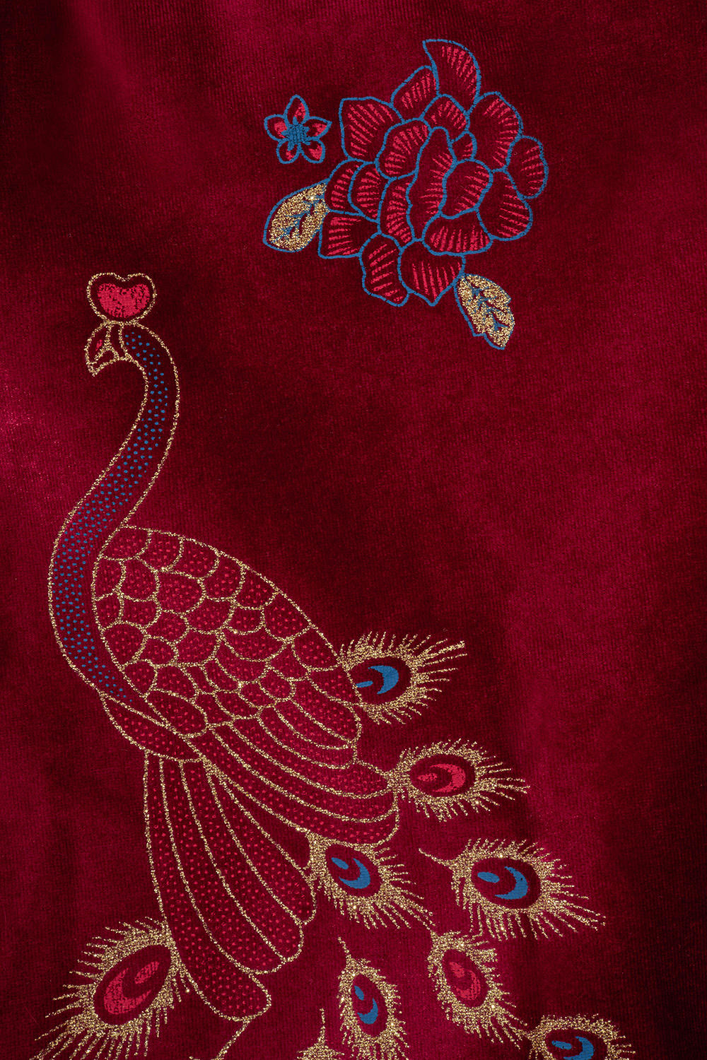 Peacock adorned cape in red