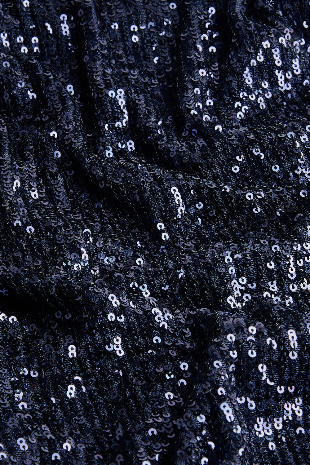 Close-up of dark blue sequin fabric 