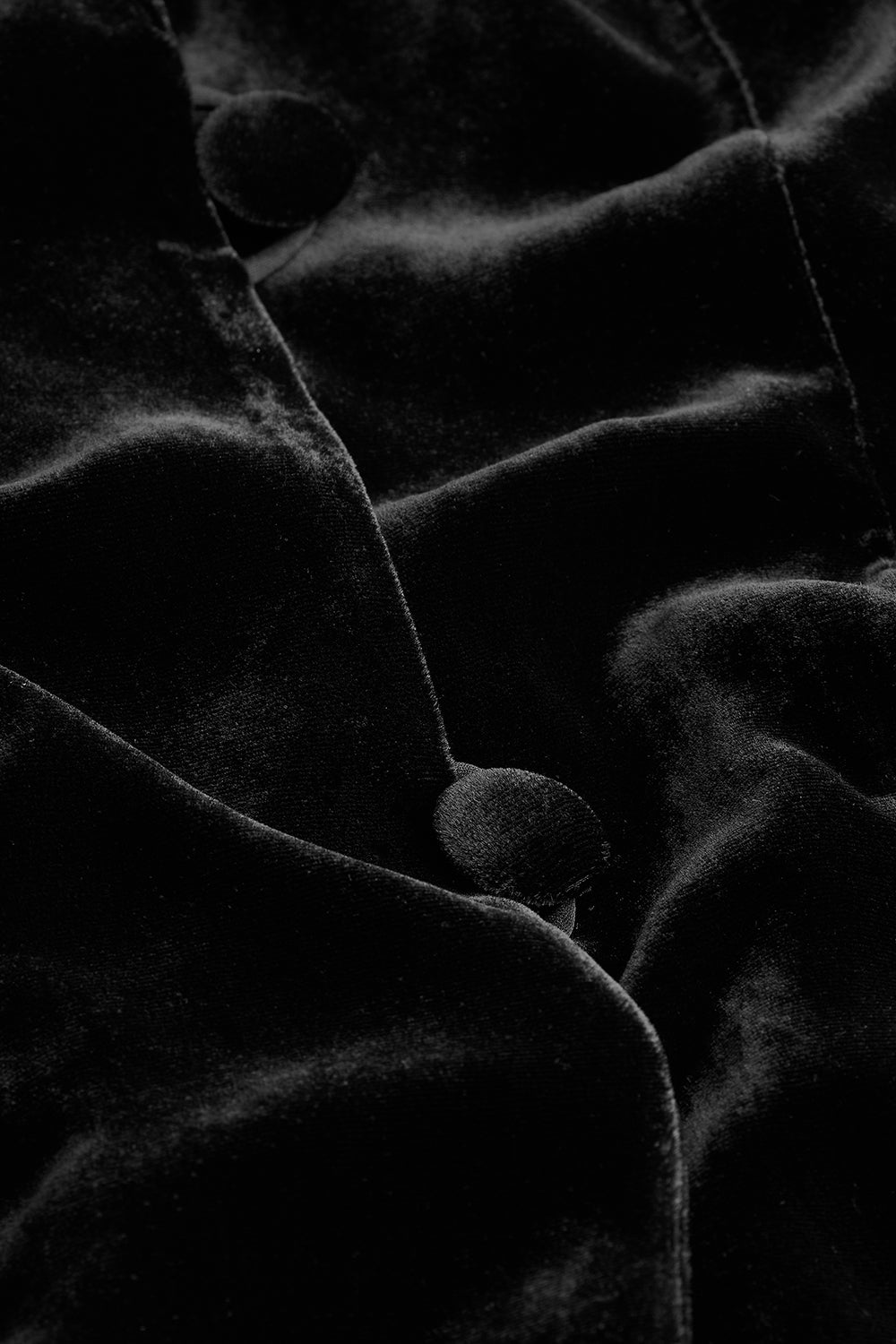 Close-up of black silk velvet fabric texture