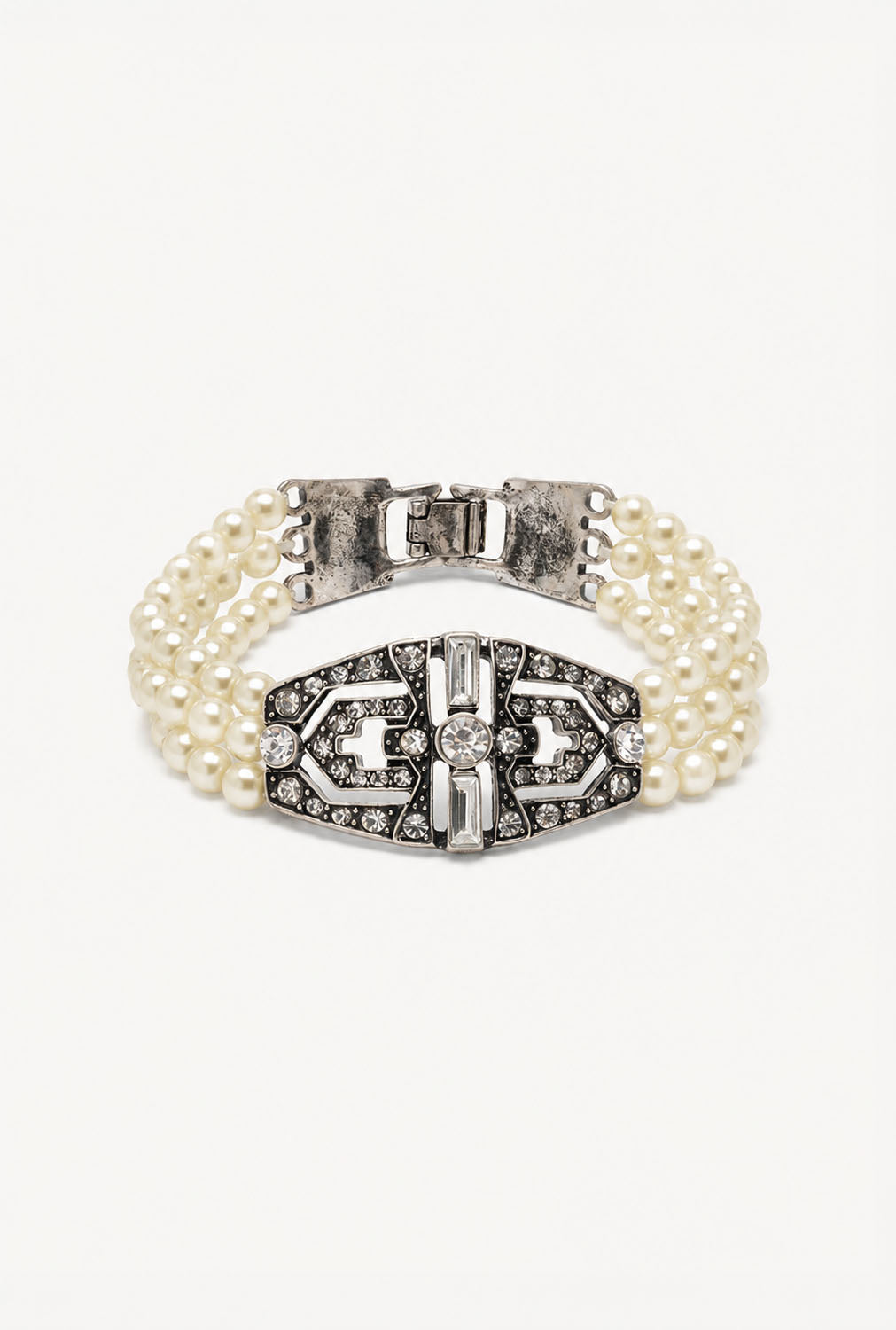 A double-row pearl bracelet with a silver-tone Art Deco style clasp adorned with clear rhinestones, shown on a plain white background.