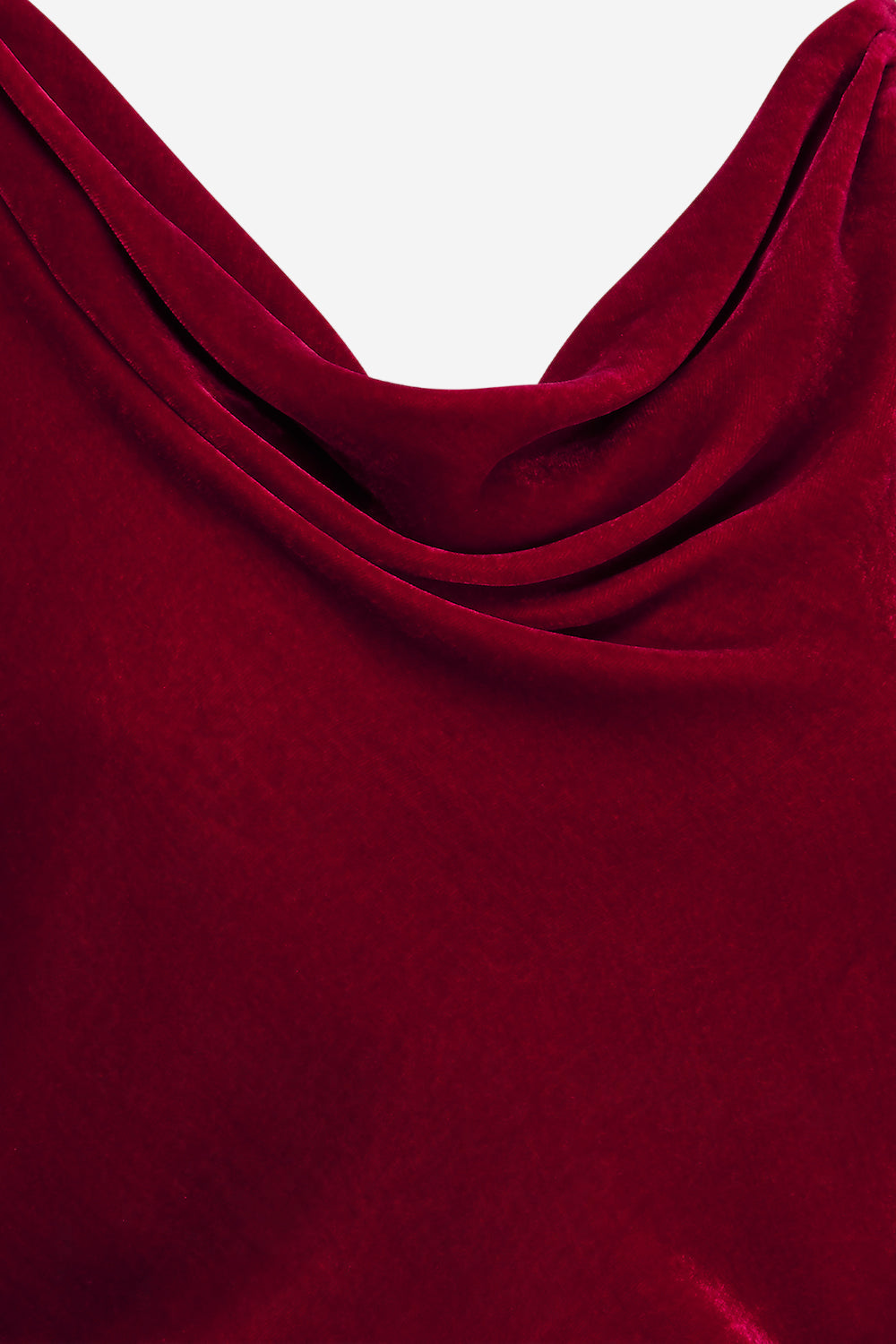 Close-up of a red fabric with a draped effect on a white background